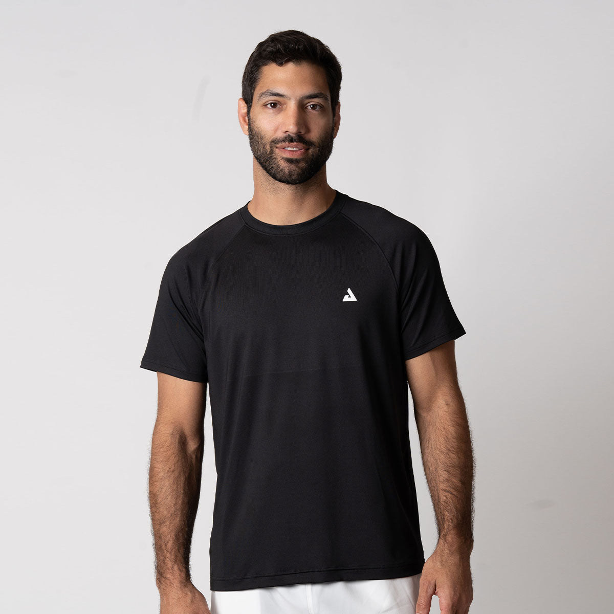 Image showing a male model wearing a JOOLA Men's Court Short Sleeve Shirt, Black.