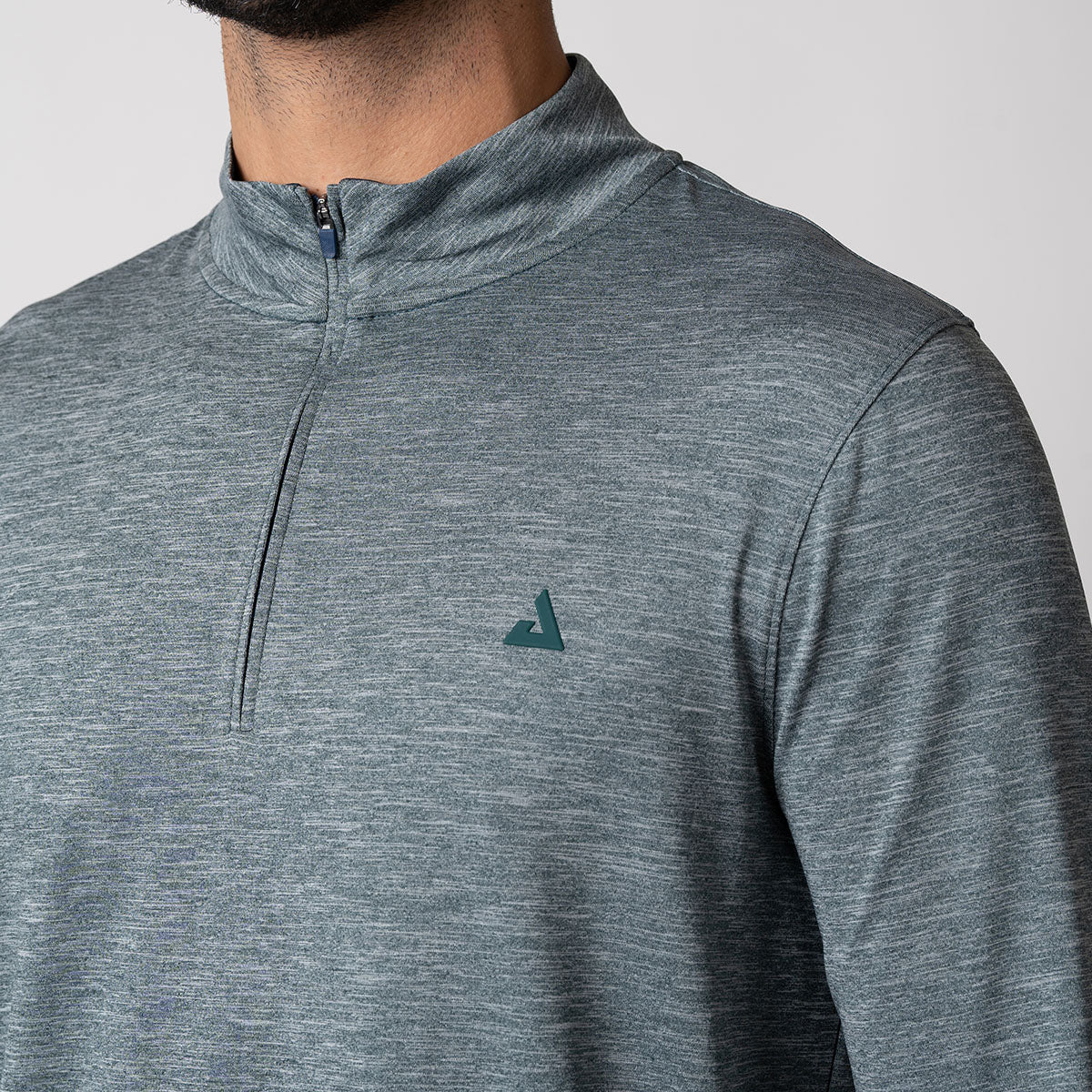 Close up image of the JOOLA Men's Quarter Zip Pullover, highlighting the JOOLA Trinity Logo at the left chest.