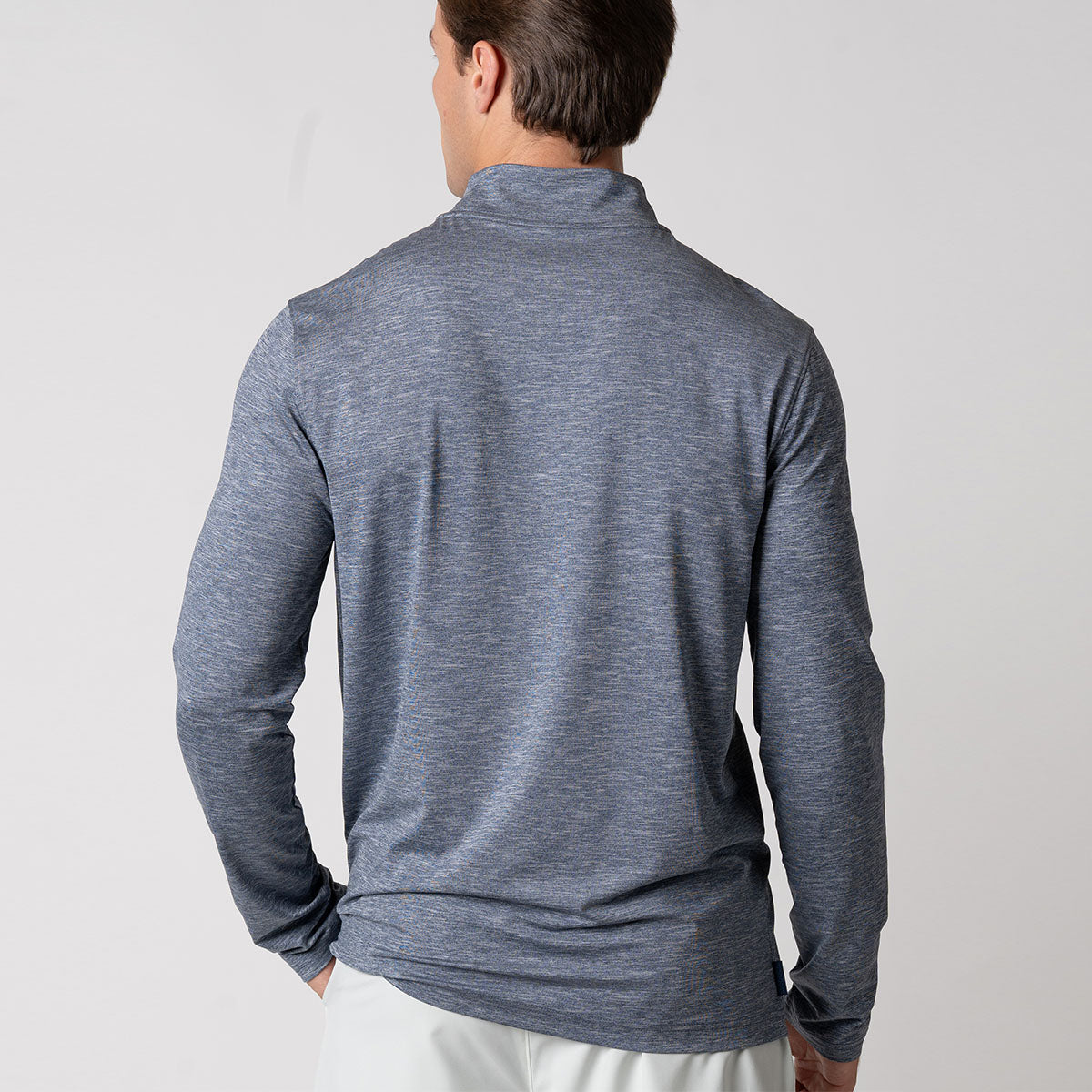 The back of a male model wearing a JOOLA Men's Quarter Zip Pullover, Navy Heather.