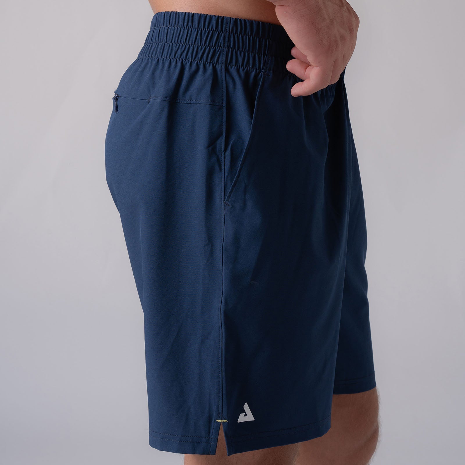 Close up image showing a side view of the JOOLA men's woven shorts, 7 inch inseam, navy.