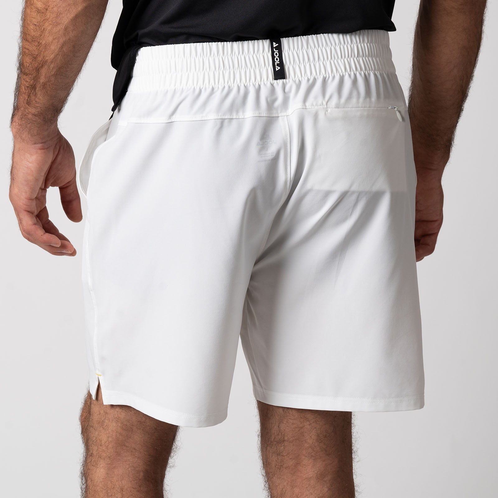 Close up image showing the back of a pair of JOOLA Men's Woven Shorts, Seven inch inseam, white.
