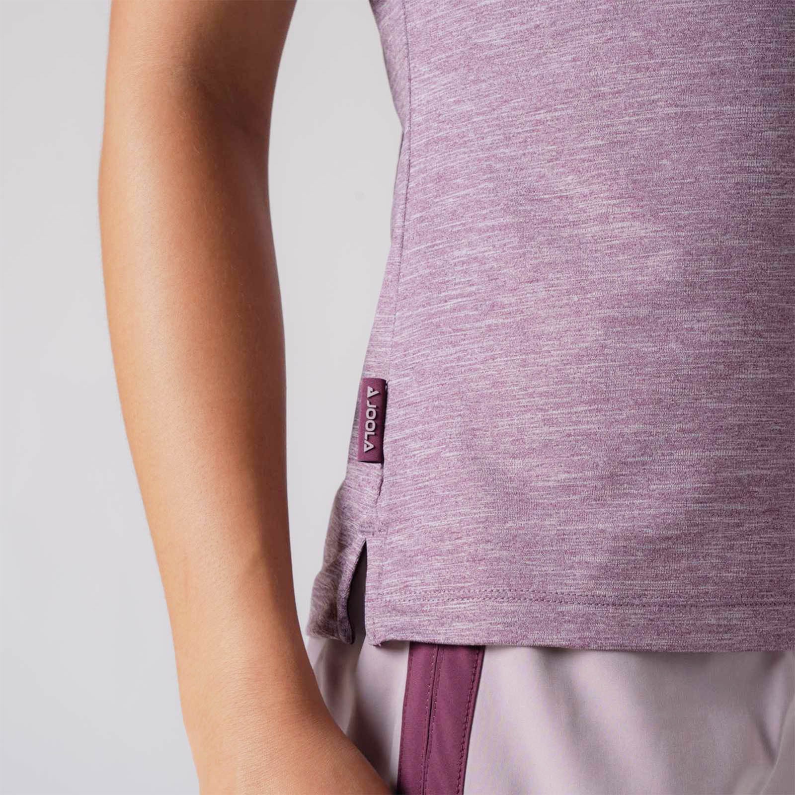 Close up image showing the raised JOOLA logo tag on the side of a JOOLA women's club polo, Bordeaux heather.