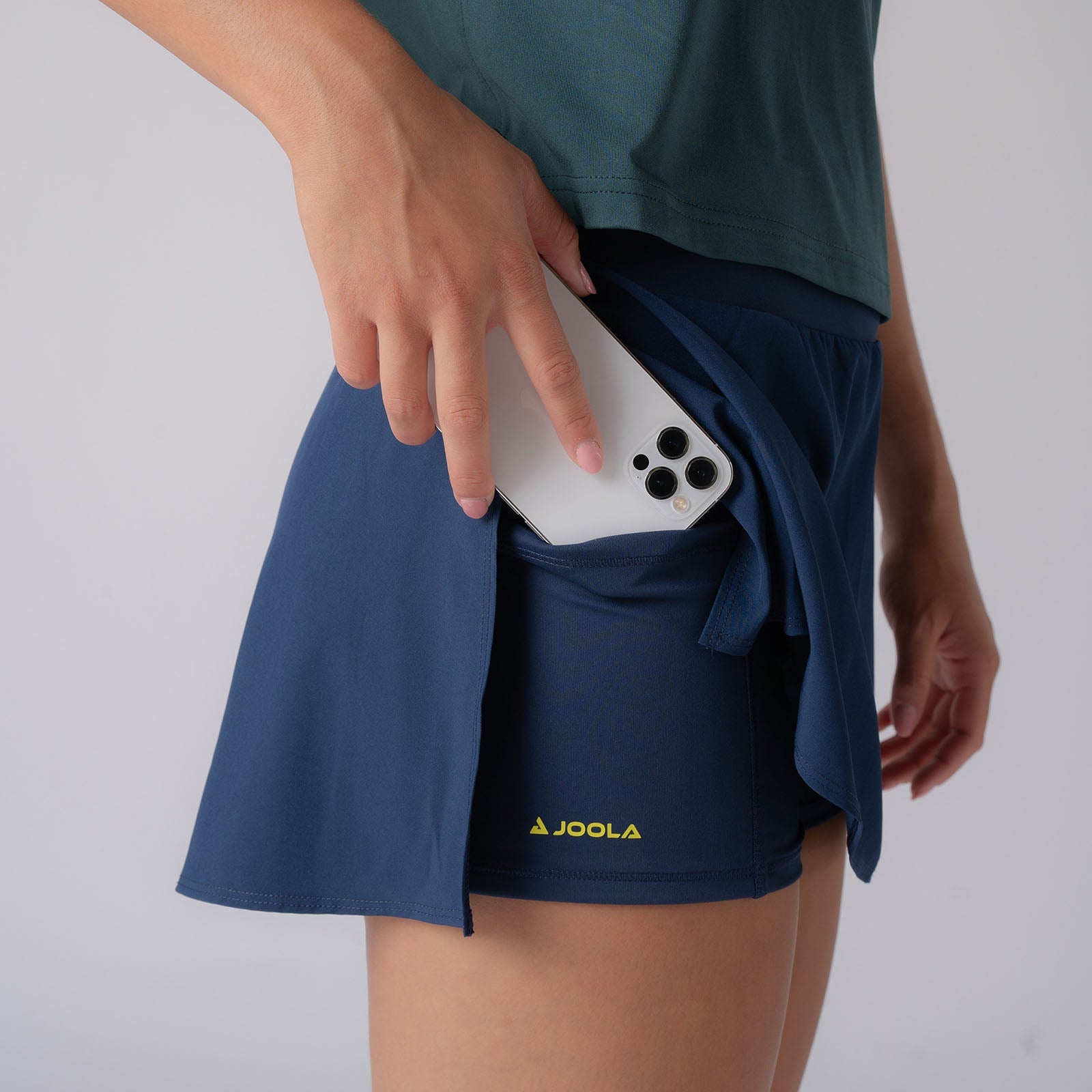 Close up image showing the hidden under pocket in the JOOLA women's pickleball skort, Navy.