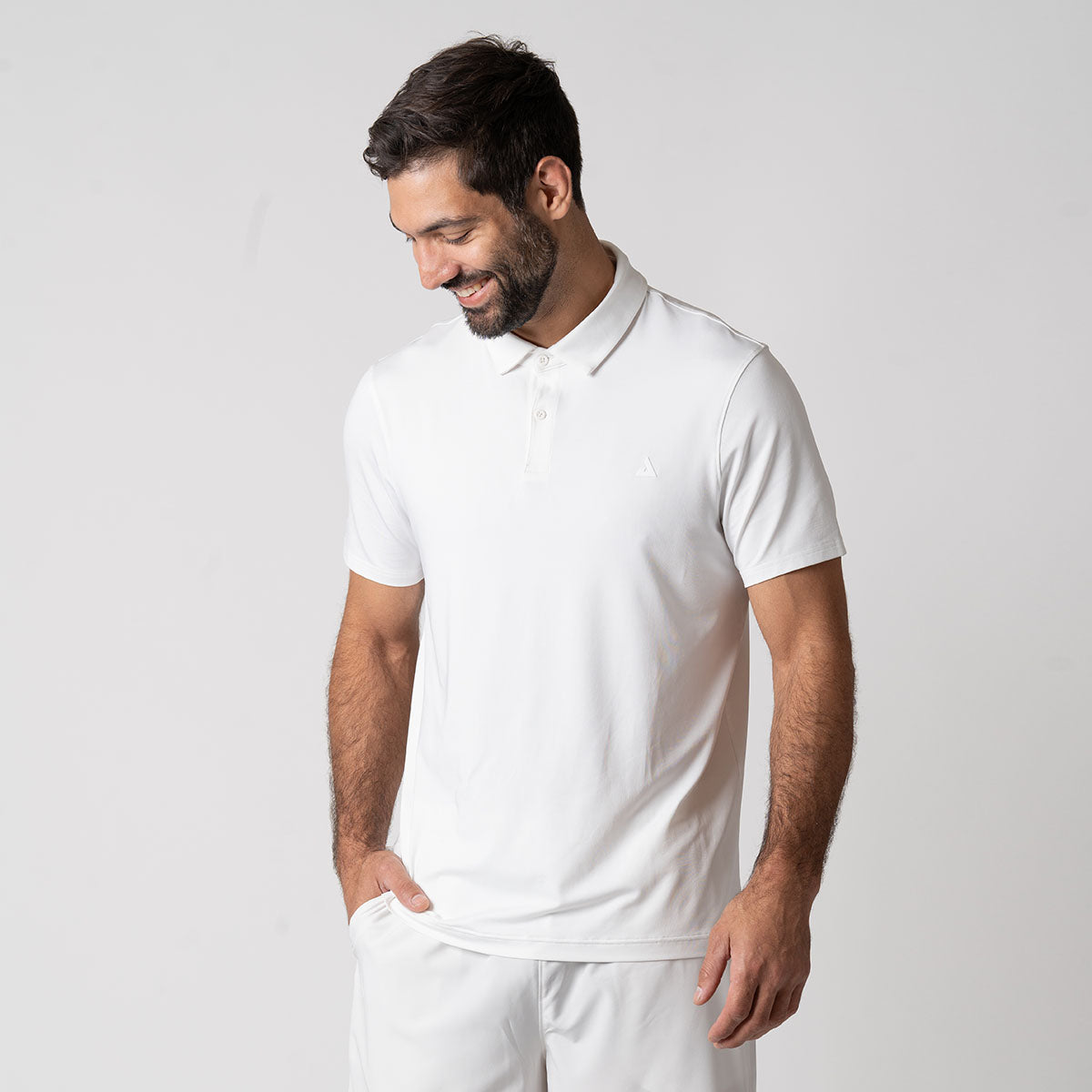 Image of a male model wearing a JOOLA men's club polo, white.
